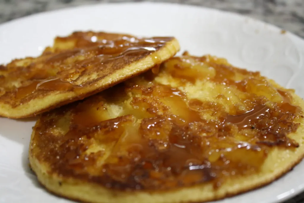 Pineapple upside down pancakes on their griddle