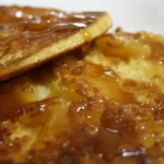 Pineapple upside down pancakes on their griddle