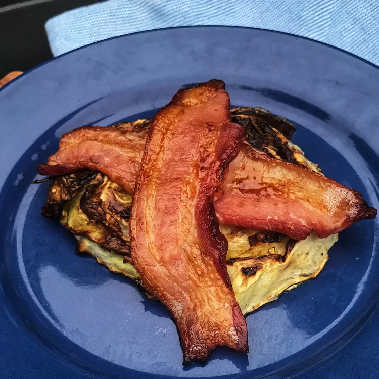 cabbage steaks wrapped in bacon sauteed